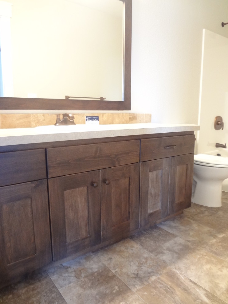 Example of a mid-sized classic master gray tile and mosaic tile ceramic tile bathroom design in Portland with shaker cabinets, dark wood cabinets, beige walls, a drop-in sink and tile countertops