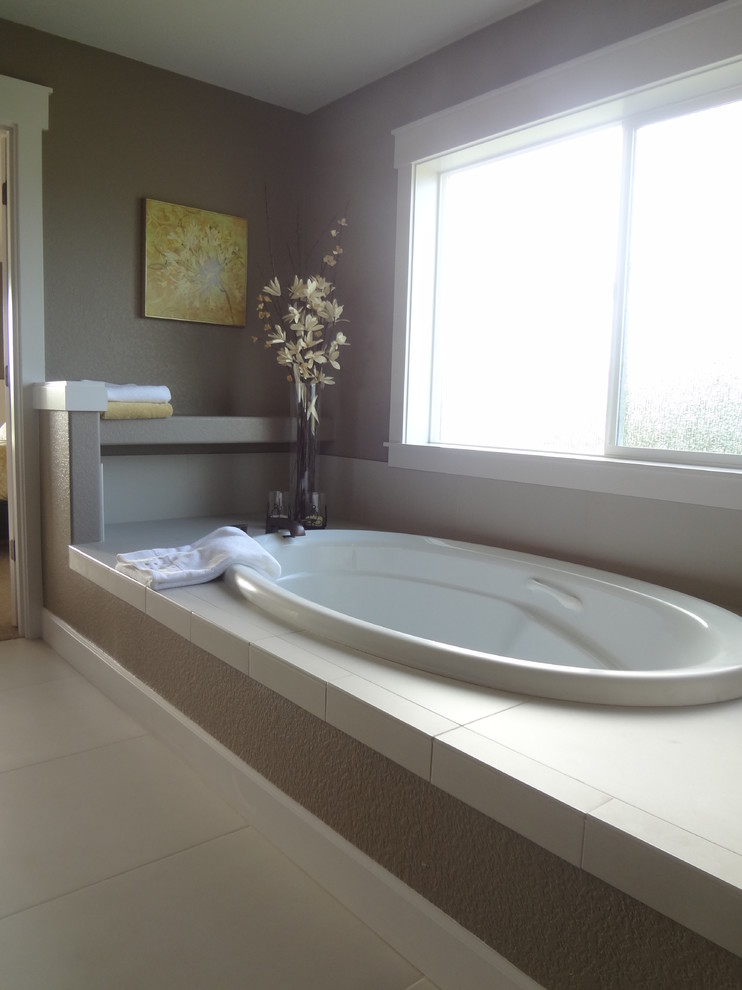 Design ideas for a medium sized traditional ensuite bathroom in Portland with shaker cabinets, dark wood cabinets, a built-in bath, an alcove shower, grey tiles, mosaic tiles, beige walls, ceramic flooring, a built-in sink and tiled worktops.