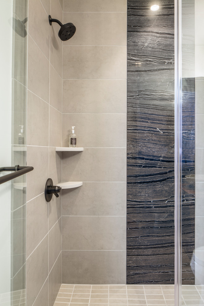 Example of a mid-sized minimalist white tile and porcelain tile limestone floor and gray floor freestanding bathtub design in Other with flat-panel cabinets, dark wood cabinets, a one-piece toilet, white walls, a vessel sink, quartz countertops, a hinged shower door and white countertops