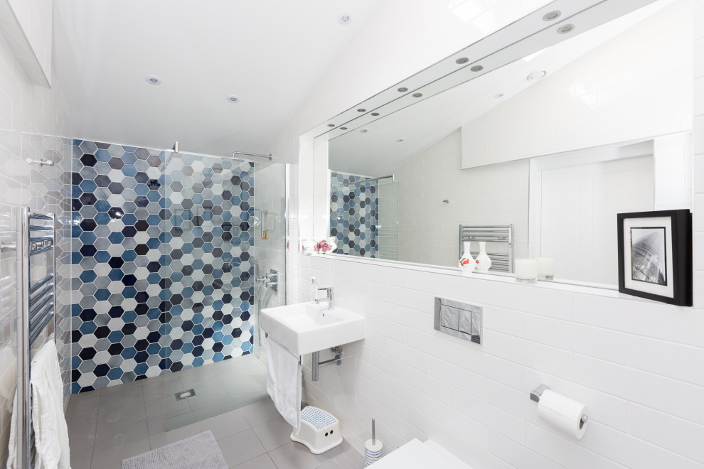 Inspiration for a mid-sized contemporary 3/4 white tile and porcelain tile porcelain tile and gray floor alcove shower remodel in Other with a wall-mount toilet, white walls and a wall-mount sink