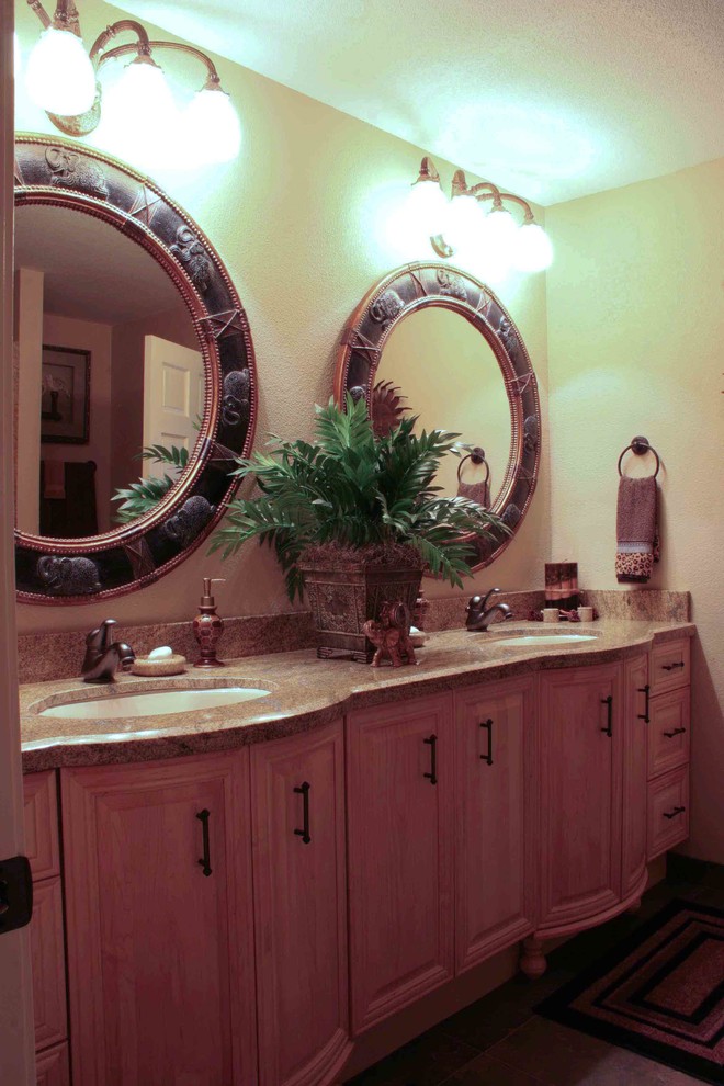 Inspiration for a large traditional ensuite bathroom in Seattle with a submerged sink, medium wood cabinets, granite worktops, a built-in shower, a two-piece toilet, brown tiles, ceramic tiles and ceramic flooring.