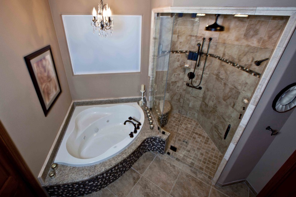 Photo of a large classic ensuite bathroom in Seattle with a submerged sink, raised-panel cabinets, a corner bath, a built-in shower, a two-piece toilet, brown tiles, ceramic tiles, beige walls and ceramic flooring.