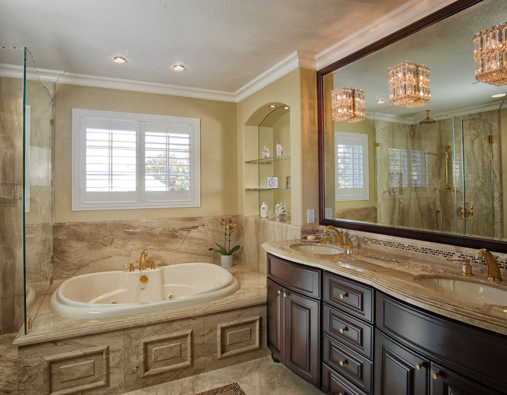 Example of a classic master beige tile and glass tile marble floor bathroom design in San Francisco with furniture-like cabinets, dark wood cabinets, marble countertops and beige walls