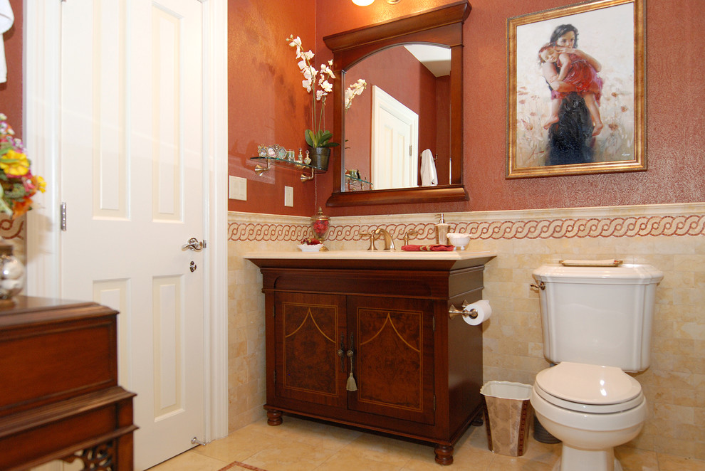 Elegant bathroom photo in New York with furniture-like cabinets and orange walls