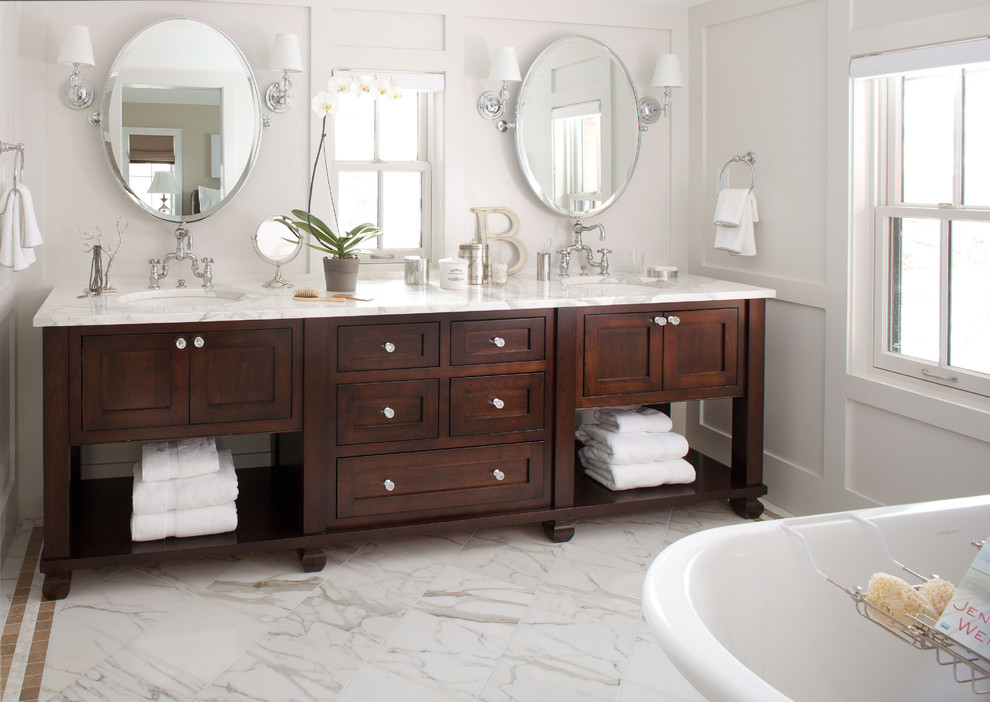 Example of a classic bathroom design in Denver with marble countertops and white countertops