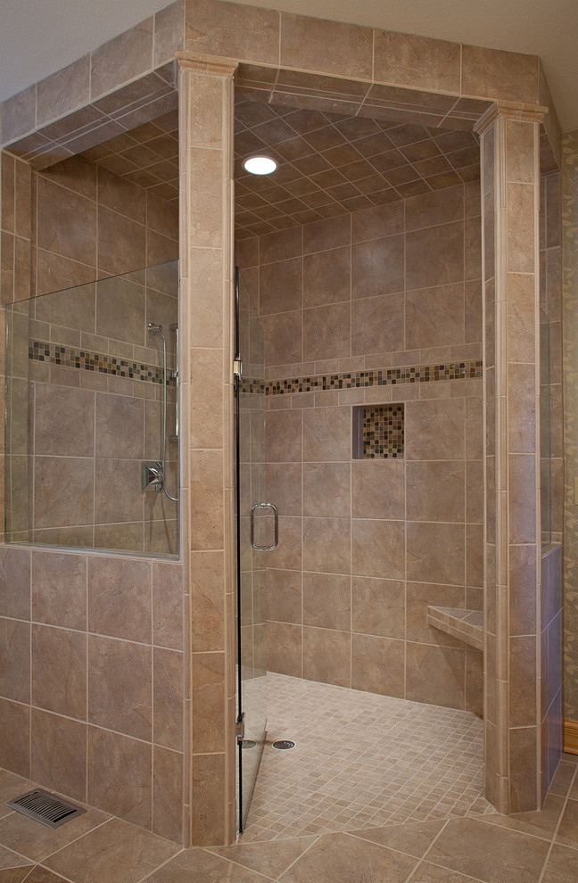 Inspiration for a traditional ensuite bathroom in Raleigh with a freestanding bath, a built-in shower, a one-piece toilet, beige tiles, ceramic tiles and ceramic flooring.