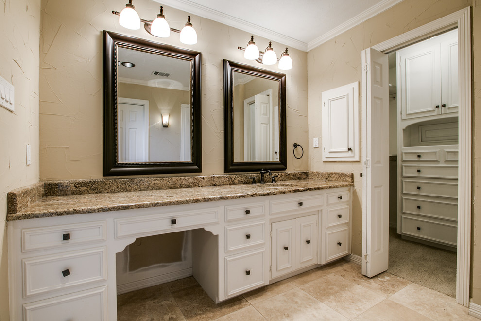 Bathroom - large traditional master brown tile and stone tile travertine floor bathroom idea in Dallas with an undermount sink, white cabinets, granite countertops, beige walls and recessed-panel cabinets