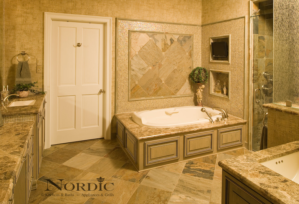 Foto på ett stort vintage en-suite badrum, med luckor med upphöjd panel, beige skåp, ett platsbyggt badkar, en dusch i en alkov, grå kakel, keramikplattor, beige väggar, klinkergolv i keramik, ett undermonterad handfat och granitbänkskiva