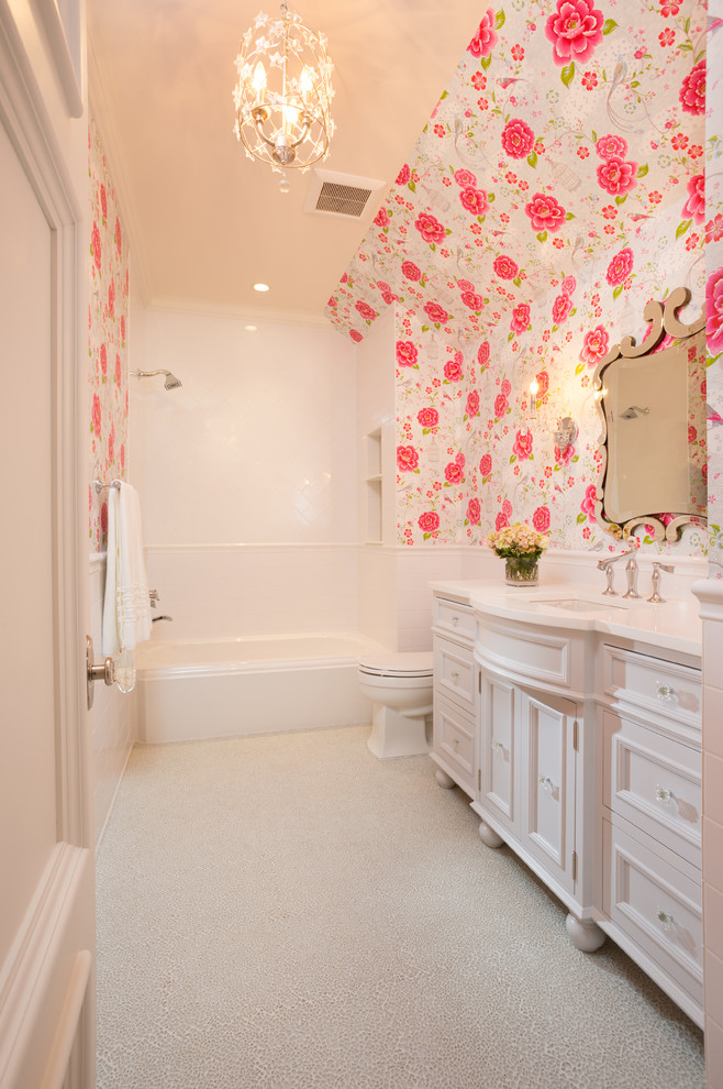 Elegant white tile bathroom photo in Minneapolis with an undermount sink, white cabinets and recessed-panel cabinets