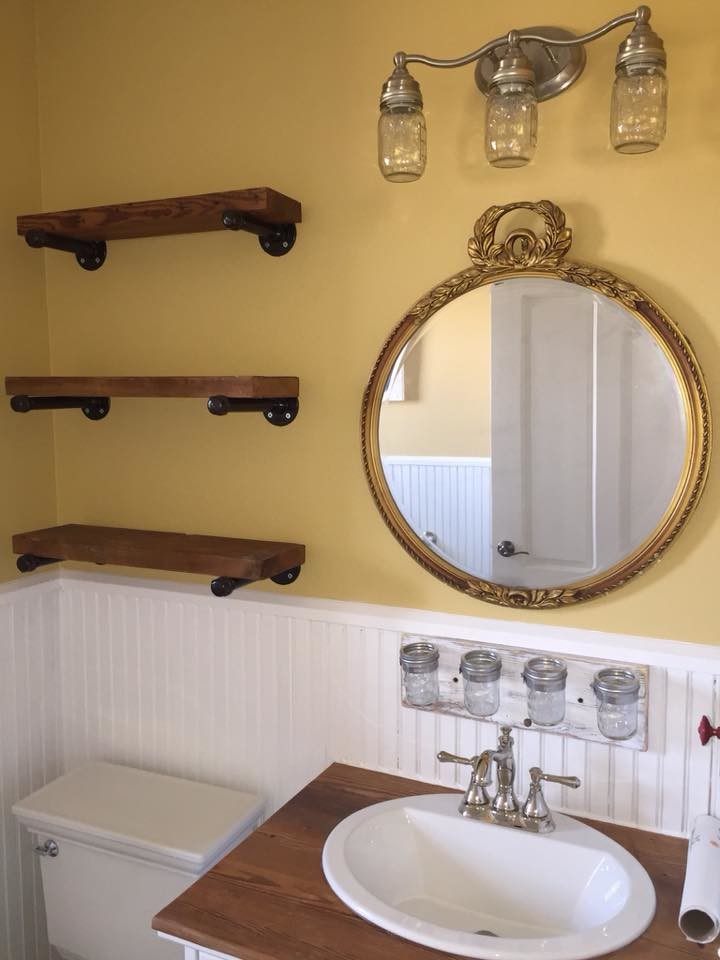 Inspiration for a small traditional shower room bathroom in Austin with freestanding cabinets, a claw-foot bath, a two-piece toilet, yellow walls, a built-in sink, wooden worktops, ceramic flooring, grey floors and a dado rail.