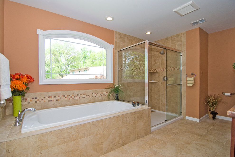 Inspiration for a mid-sized timeless master beige tile and ceramic tile ceramic tile bathroom remodel in Other with brown walls, an undermount sink, raised-panel cabinets, medium tone wood cabinets, granite countertops and a one-piece toilet