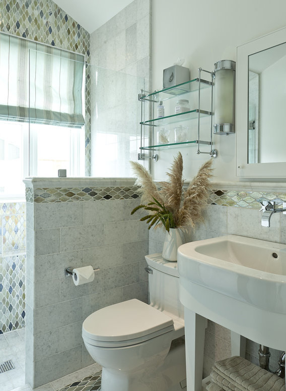 Photo of a medium sized classic shower room bathroom in Orange County with freestanding cabinets, white cabinets, an alcove shower, a one-piece toilet, grey tiles, multi-coloured tiles, mosaic tiles, white walls, ceramic flooring, a console sink, grey floors and an open shower.