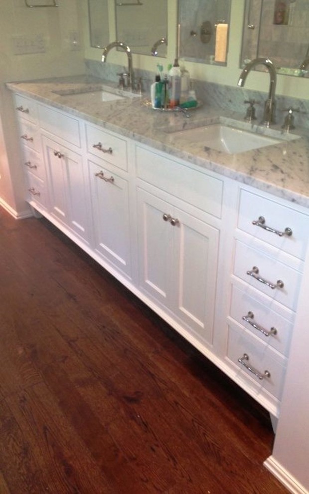 Example of a classic kids' medium tone wood floor bathroom design in Raleigh with an undermount sink, beaded inset cabinets, white cabinets, granite countertops and green walls