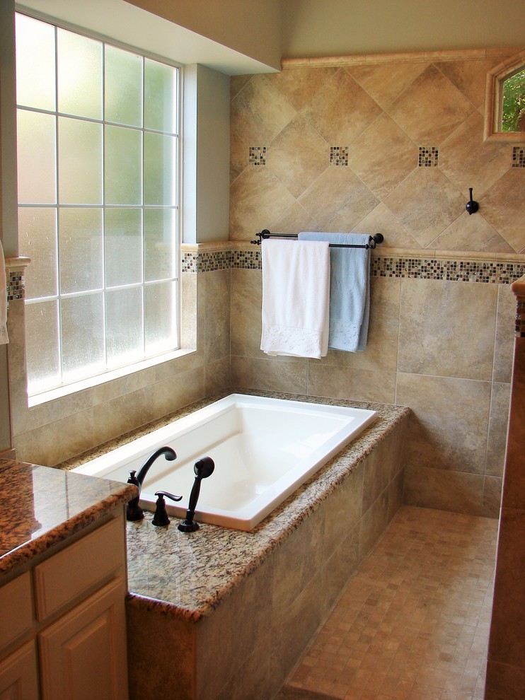 Bathroom - mid-sized traditional master beige tile and porcelain tile mosaic tile floor and beige floor bathroom idea in Dallas with an undermount sink, raised-panel cabinets, white cabinets, granite countertops, a two-piece toilet and beige walls