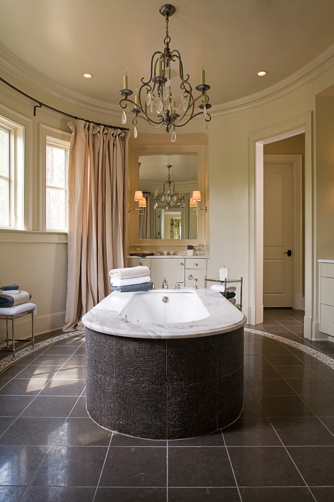 Design ideas for a classic bathroom in Other with flat-panel cabinets, beige cabinets and a submerged bath.