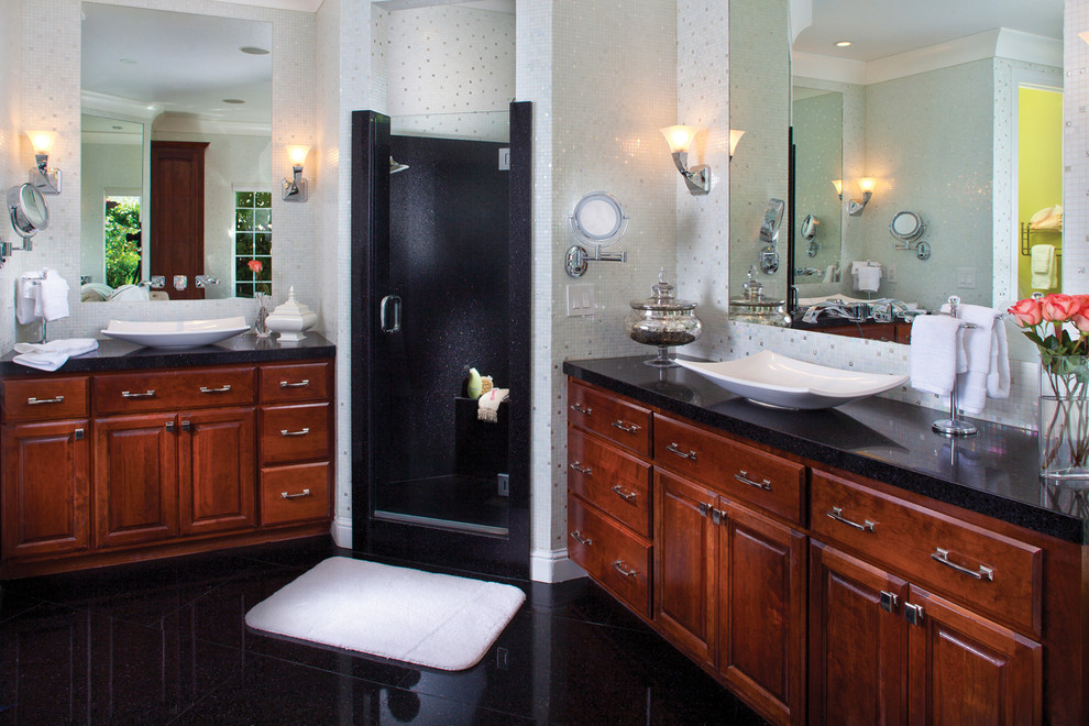 Exemple d'une grande douche en alcôve principale chic en bois brun avec une vasque, un placard avec porte à panneau surélevé, un plan de toilette en verre recyclé, une baignoire indépendante, un carrelage blanc, un carrelage en pâte de verre et un mur blanc.