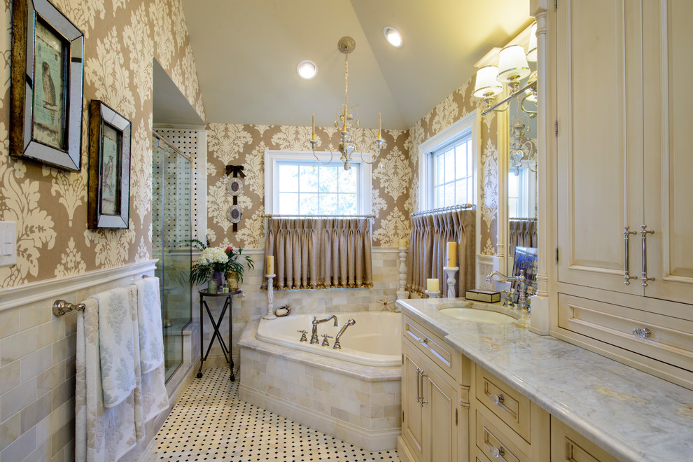Inspiration for a classic shower room bathroom in New Orleans with recessed-panel cabinets, beige cabinets, a corner bath, a corner shower, beige tiles, metro tiles, brown walls, a submerged sink, beige floors and a hinged door.
