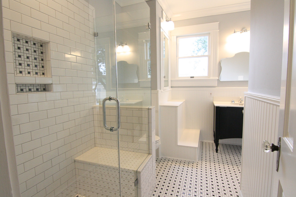 Design ideas for a medium sized traditional shower room bathroom in Houston with black cabinets, a corner shower, white tiles, metro tiles, grey walls, ceramic flooring, a submerged sink, multi-coloured floors, a hinged door, a two-piece toilet, a claw-foot bath, freestanding cabinets and solid surface worktops.
