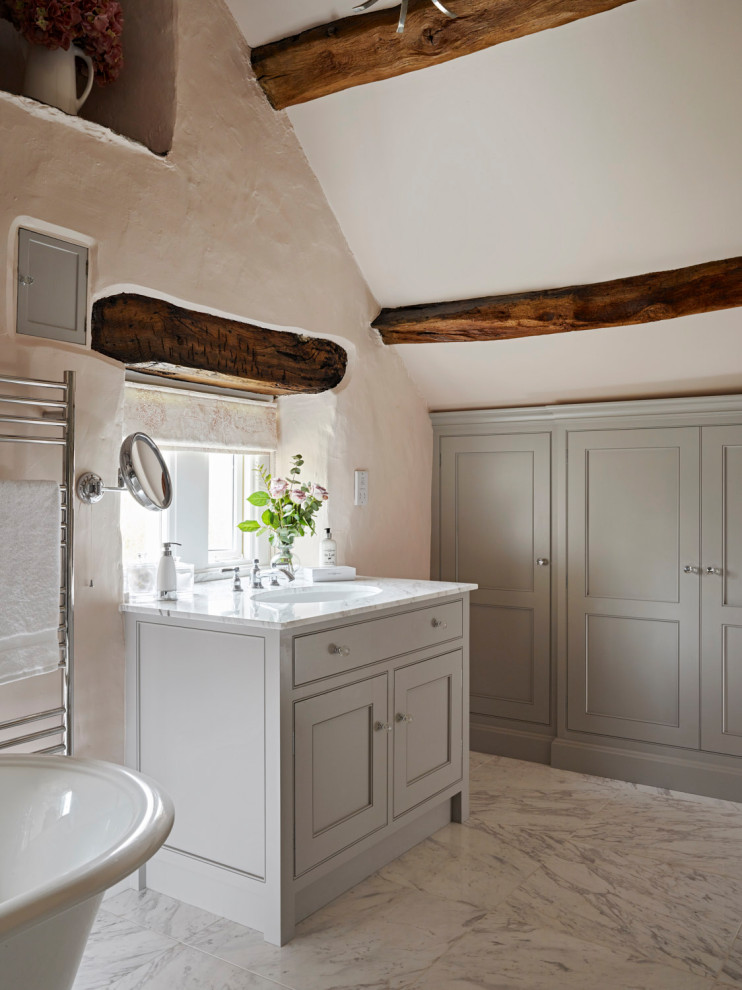 This is an example of a large traditional family bathroom in Other with beaded cabinets, grey cabinets, a freestanding bath, a built-in sink, marble worktops, white worktops, a single sink, a built in vanity unit and exposed beams.