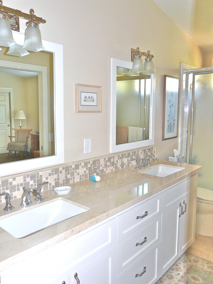 Example of a classic beige tile and mosaic tile travertine floor bathroom design in San Diego with an undermount sink, shaker cabinets, white cabinets, marble countertops and beige walls