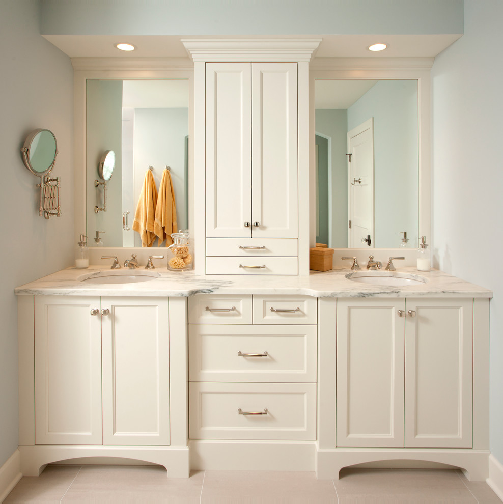 Elegant bathroom photo in Minneapolis with an undermount sink, recessed-panel cabinets and white cabinets