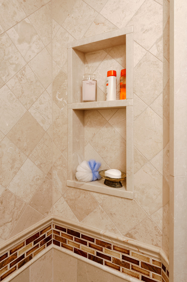 Corner shower - mid-sized traditional master multicolored tile and stone tile marble floor corner shower idea in DC Metro with an undermount sink, raised-panel cabinets, dark wood cabinets, granite countertops, a one-piece toilet and beige walls