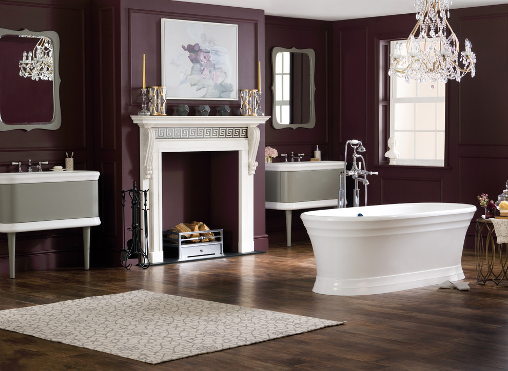 This is an example of a large traditional ensuite bathroom in San Francisco with freestanding cabinets, grey cabinets, a freestanding bath, a shower/bath combination, purple walls, dark hardwood flooring, an integrated sink, solid surface worktops, brown floors and an open shower.