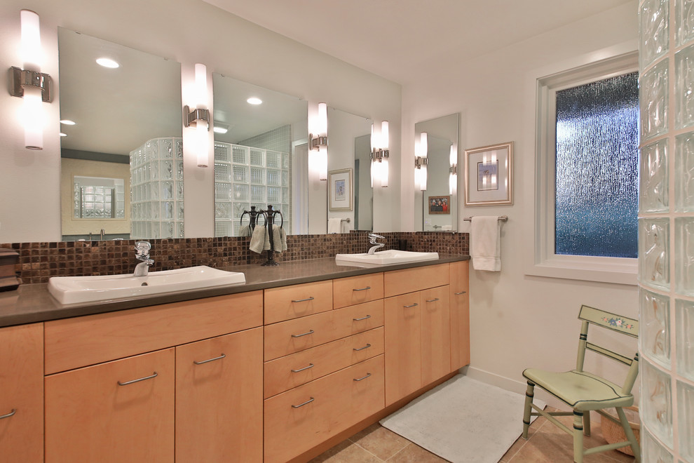 Large classic ensuite bathroom in Seattle with flat-panel cabinets, medium wood cabinets, a claw-foot bath, glass tiles, white walls, porcelain flooring, a built-in sink, engineered stone worktops, brown floors, brown worktops and a hinged door.