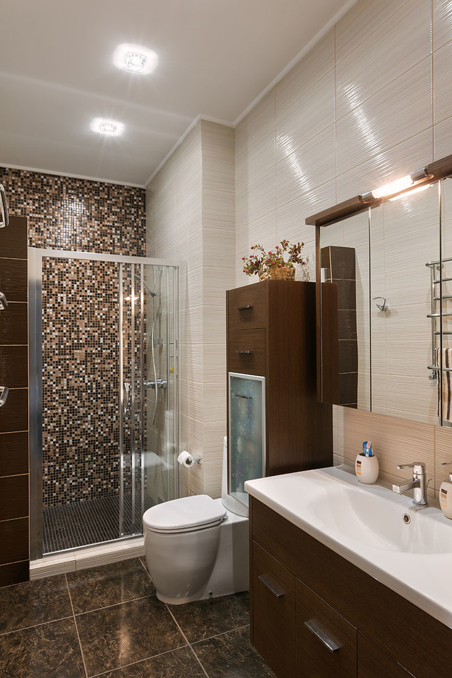 Medium sized contemporary ensuite bathroom in Other with a one-piece toilet, mosaic tiles, beige walls, ceramic flooring, flat-panel cabinets, an alcove shower and brown tiles.