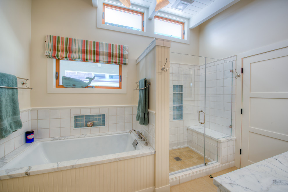 Photo of a nautical bathroom in San Francisco with a submerged bath and an alcove shower.