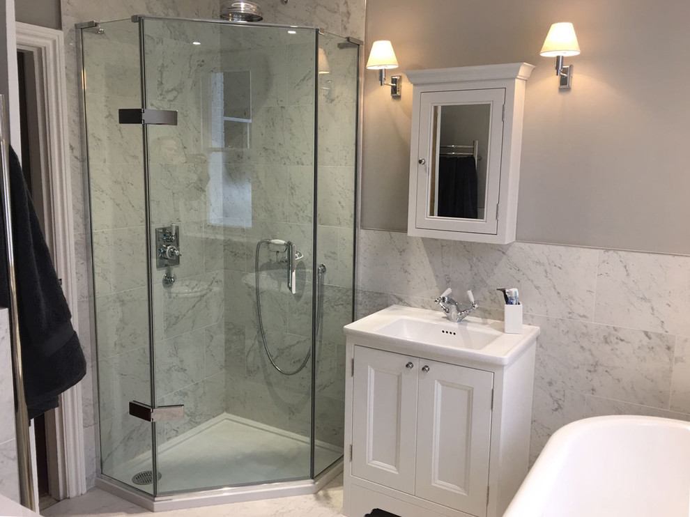 Example of a small classic porcelain tile bathroom design in Hertfordshire with marble countertops