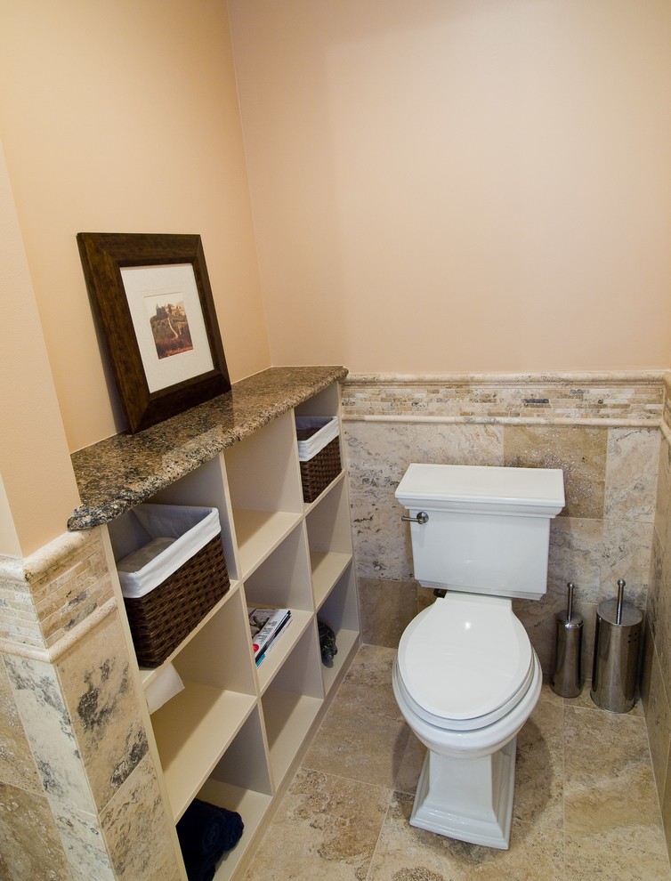 Inspiration pour une salle de bain principale traditionnelle en bois brun avec un lavabo encastré, un placard à porte affleurante, un plan de toilette en granite, une baignoire indépendante, une douche d'angle, un carrelage de pierre et un sol en travertin.