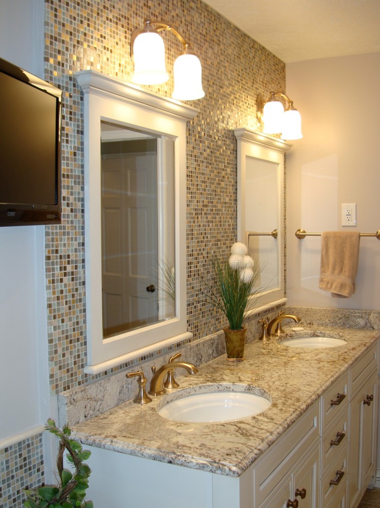 Bathroom - mid-sized traditional master beige tile and stone tile porcelain tile bathroom idea in Salt Lake City with an undermount sink, recessed-panel cabinets, white cabinets, granite countertops, a two-piece toilet and white walls