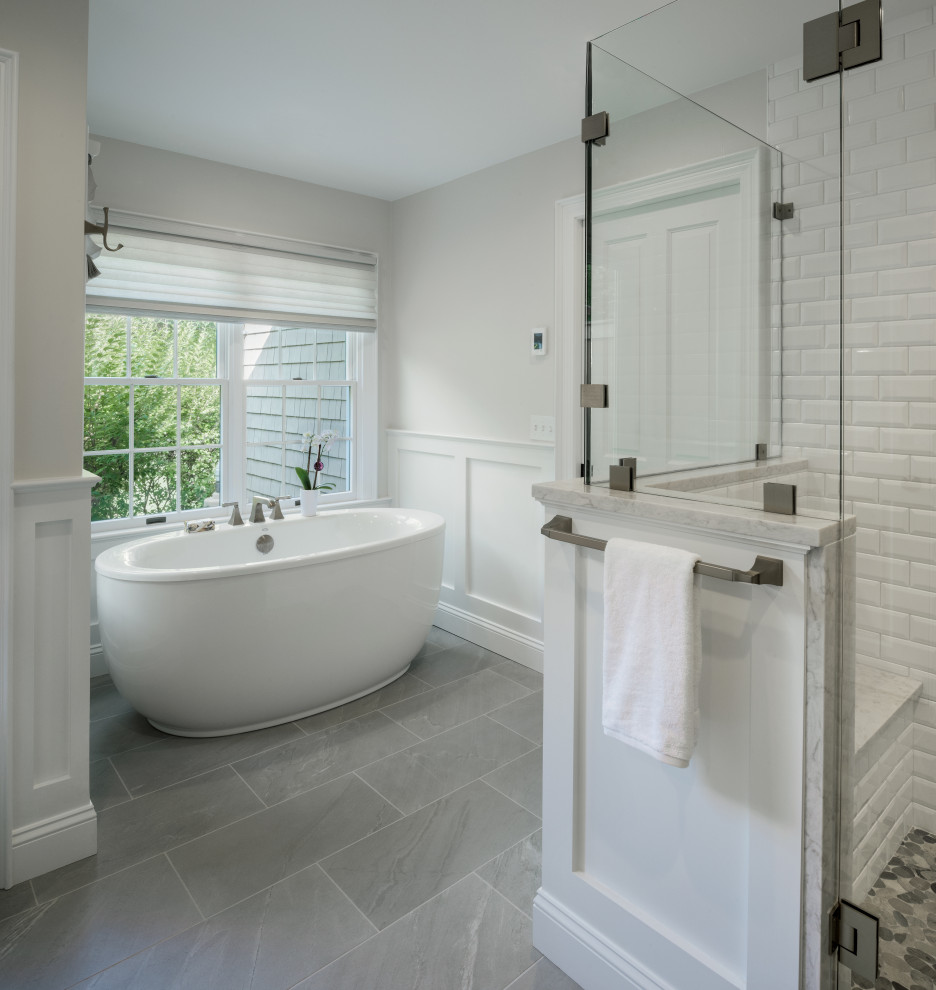 Example of a mid-sized classic master white tile porcelain tile, beige floor, double-sink and wainscoting bathroom design in Providence with dark wood cabinets, a one-piece toilet, white walls, an undermount sink, quartzite countertops, a hinged shower door, white countertops and a built-in vanity