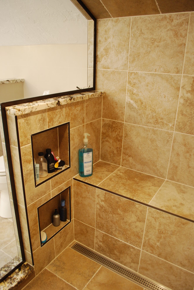 Photo of a large rural ensuite wet room bathroom in Cleveland with recessed-panel cabinets, beige cabinets, a claw-foot bath, a two-piece toilet, multi-coloured tiles, ceramic tiles, beige walls, porcelain flooring, a submerged sink, granite worktops, multi-coloured floors and a hinged door.
