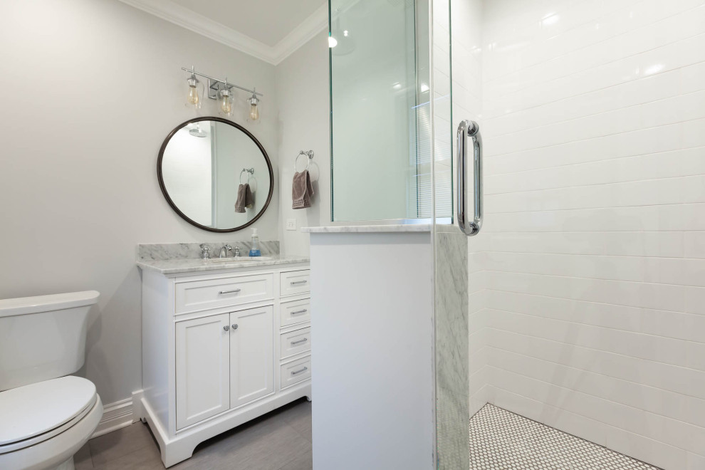 This is an example of a small classic family bathroom in Chicago with beaded cabinets, white cabinets, a corner shower, grey walls, ceramic flooring, a submerged sink, engineered stone worktops, grey floors, a hinged door, grey worktops, a wall niche, a single sink and a freestanding vanity unit.