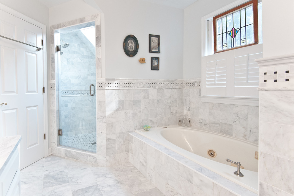 Inspiration for a mid-sized timeless master black and white tile and stone tile marble floor bathroom remodel in DC Metro with recessed-panel cabinets, white cabinets, a two-piece toilet, white walls, an undermount sink and marble countertops