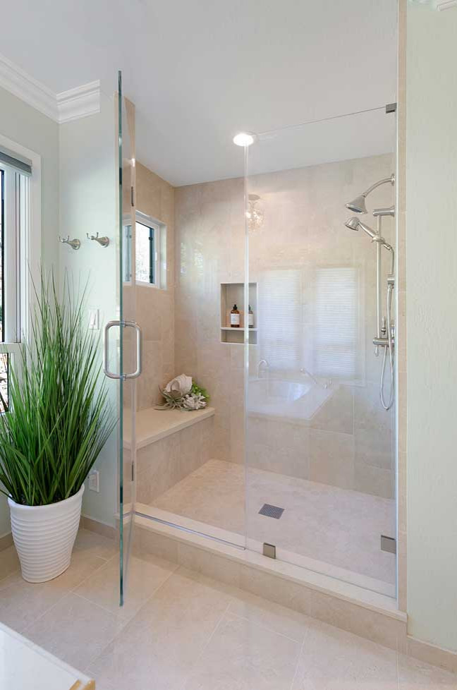 Inspiration for a large timeless master beige tile and porcelain tile porcelain tile, beige floor and double-sink bathroom remodel in San Francisco with recessed-panel cabinets, beige cabinets, an undermount tub, a two-piece toilet, green walls, an undermount sink, quartz countertops, a hinged shower door, beige countertops and a built-in vanity