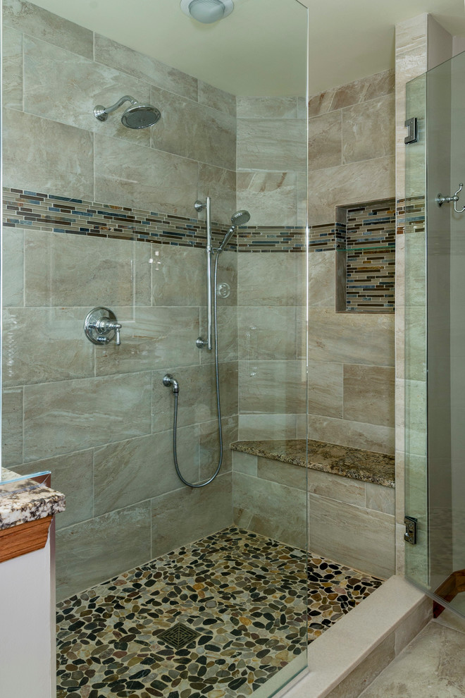 Large classic ensuite bathroom in Chicago with a submerged sink, raised-panel cabinets, medium wood cabinets, granite worktops, a freestanding bath, a walk-in shower, a two-piece toilet, beige tiles, porcelain tiles, beige walls and porcelain flooring.