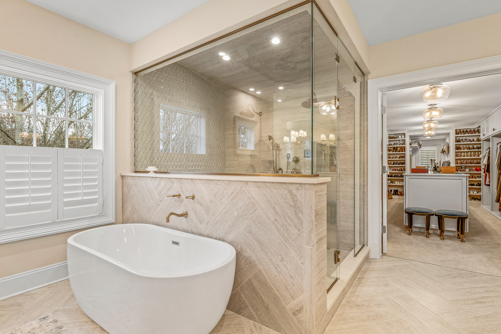 Example of a huge classic master light wood floor and beige floor bathroom design in Cleveland with recessed-panel cabinets, beige cabinets, beige walls, an undermount sink, marble countertops, a hinged shower door and beige countertops