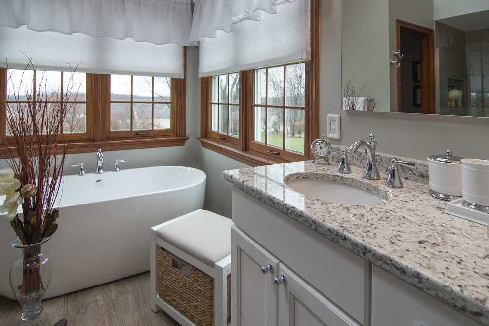 Inspiration for a classic bathroom in Other with shaker cabinets, white cabinets and a freestanding bath.