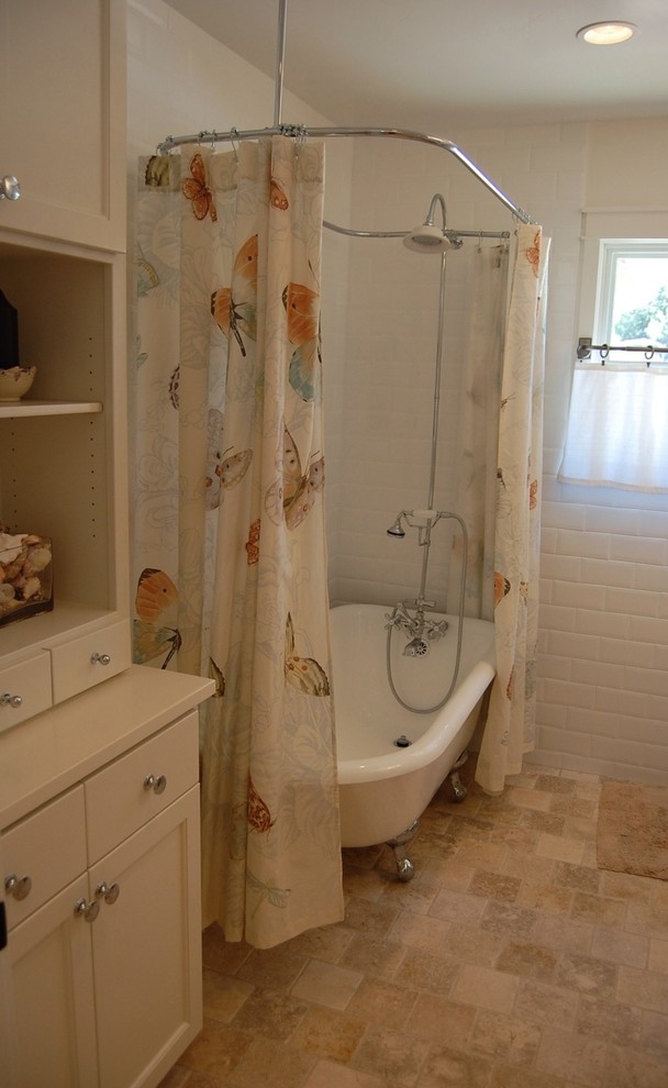 Example of a small classic beige tile and stone tile travertine floor bathroom design in Orange County with a pedestal sink, recessed-panel cabinets, white cabinets, a two-piece toilet and white walls