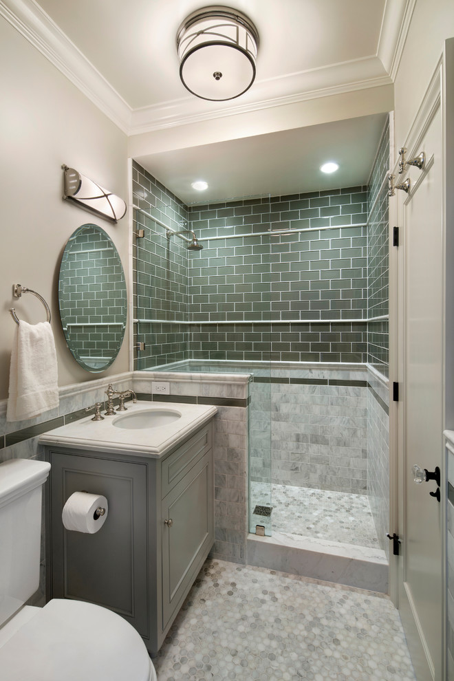 Example of a small classic master gray tile and subway tile mosaic tile floor corner shower design in San Francisco with recessed-panel cabinets, gray cabinets, a two-piece toilet, gray walls, an undermount sink and marble countertops