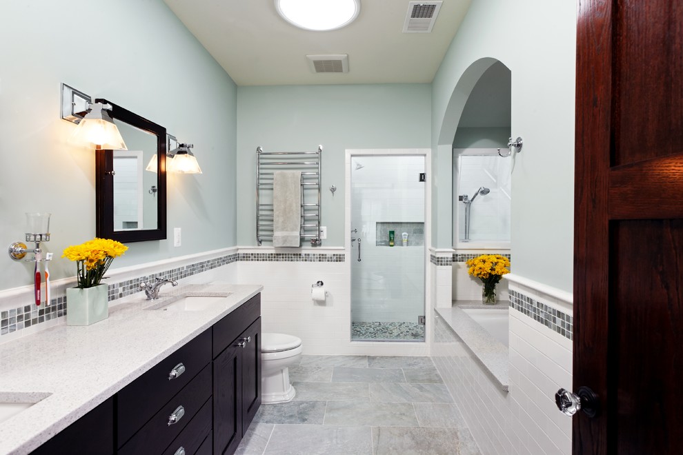 Example of a large tuscan master white tile and ceramic tile porcelain tile bathroom design in DC Metro with an undermount sink, recessed-panel cabinets, dark wood cabinets, quartzite countertops, a two-piece toilet and green walls
