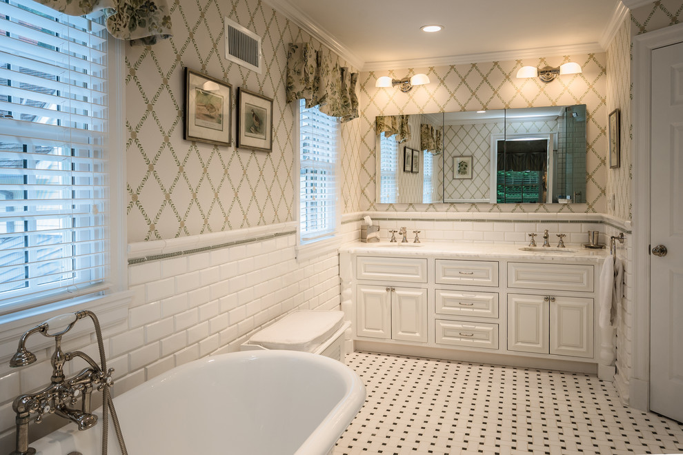 Inspiration for a large timeless master white tile and subway tile mosaic tile floor and multicolored floor bathroom remodel in New York with beige walls, raised-panel cabinets, white cabinets, a drop-in sink and a hinged shower door