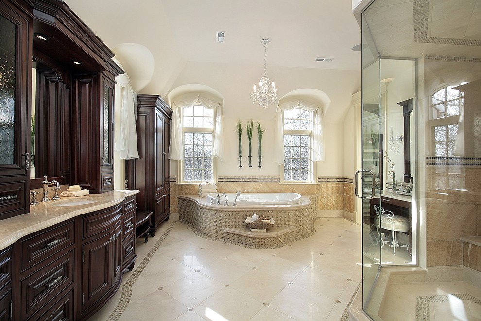 Bathroom - huge traditional master beige tile and stone tile limestone floor bathroom idea in Atlanta with an undermount sink, beaded inset cabinets, dark wood cabinets, quartz countertops, a one-piece toilet and white walls