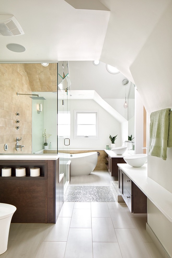 Example of a mid-sized transitional master beige tile and porcelain tile porcelain tile and multicolored floor bathroom design in Denver with recessed-panel cabinets, dark wood cabinets, a one-piece toilet, green walls, a vessel sink, quartz countertops, a hinged shower door and white countertops