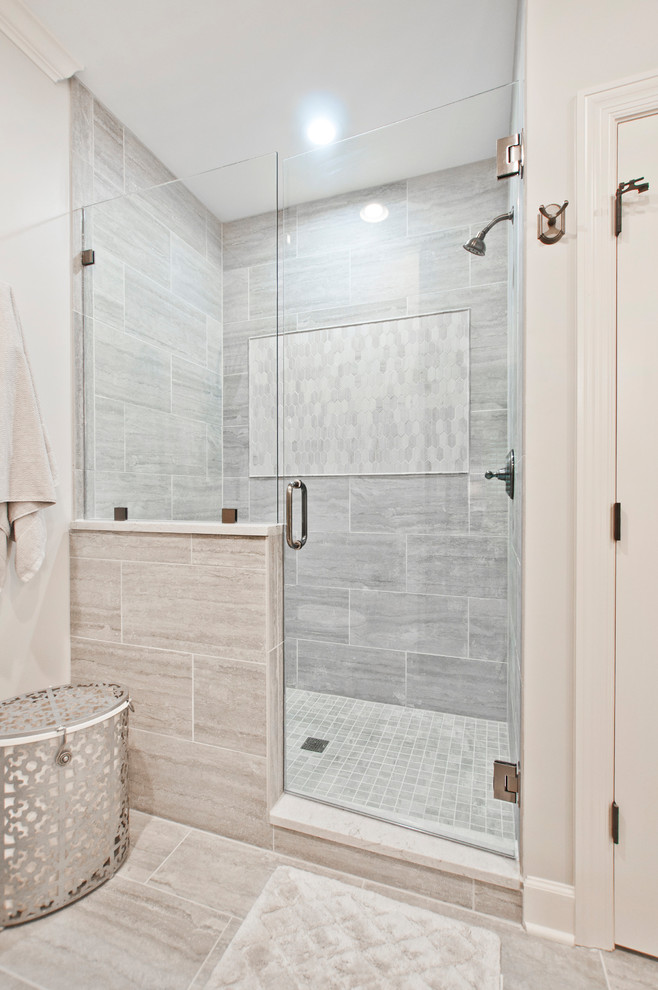 Medium sized traditional ensuite bathroom in Nashville with beaded cabinets, white cabinets, an alcove shower, a two-piece toilet, grey tiles, porcelain tiles, grey walls, porcelain flooring, a submerged sink and engineered stone worktops.