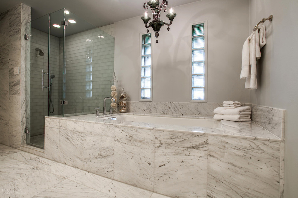 Large transitional master white tile and glass tile marble floor bathroom photo in Dallas with an undermount sink, recessed-panel cabinets, white cabinets, marble countertops, a one-piece toilet and gray walls