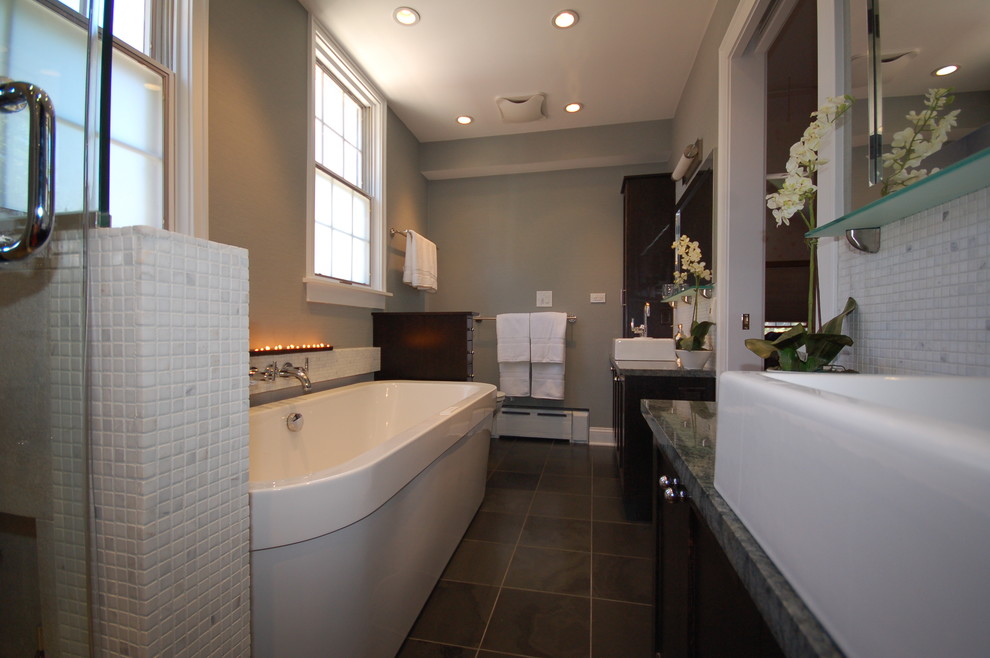 Freestanding bathtub - large contemporary master white tile slate floor freestanding bathtub idea in Chicago with a vessel sink, shaker cabinets, dark wood cabinets, marble countertops, a two-piece toilet and gray walls